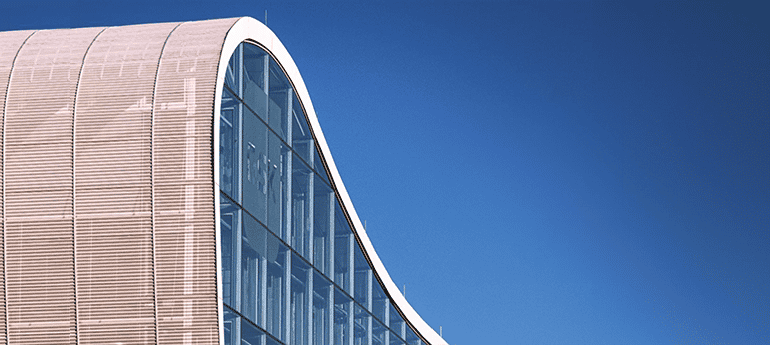 photo of a modern building with a curved roof